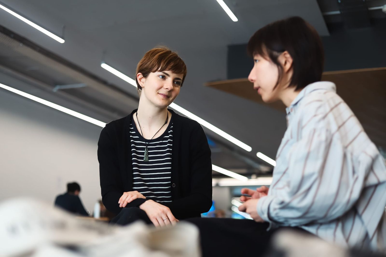 Two colleagues in thoughtful discussion