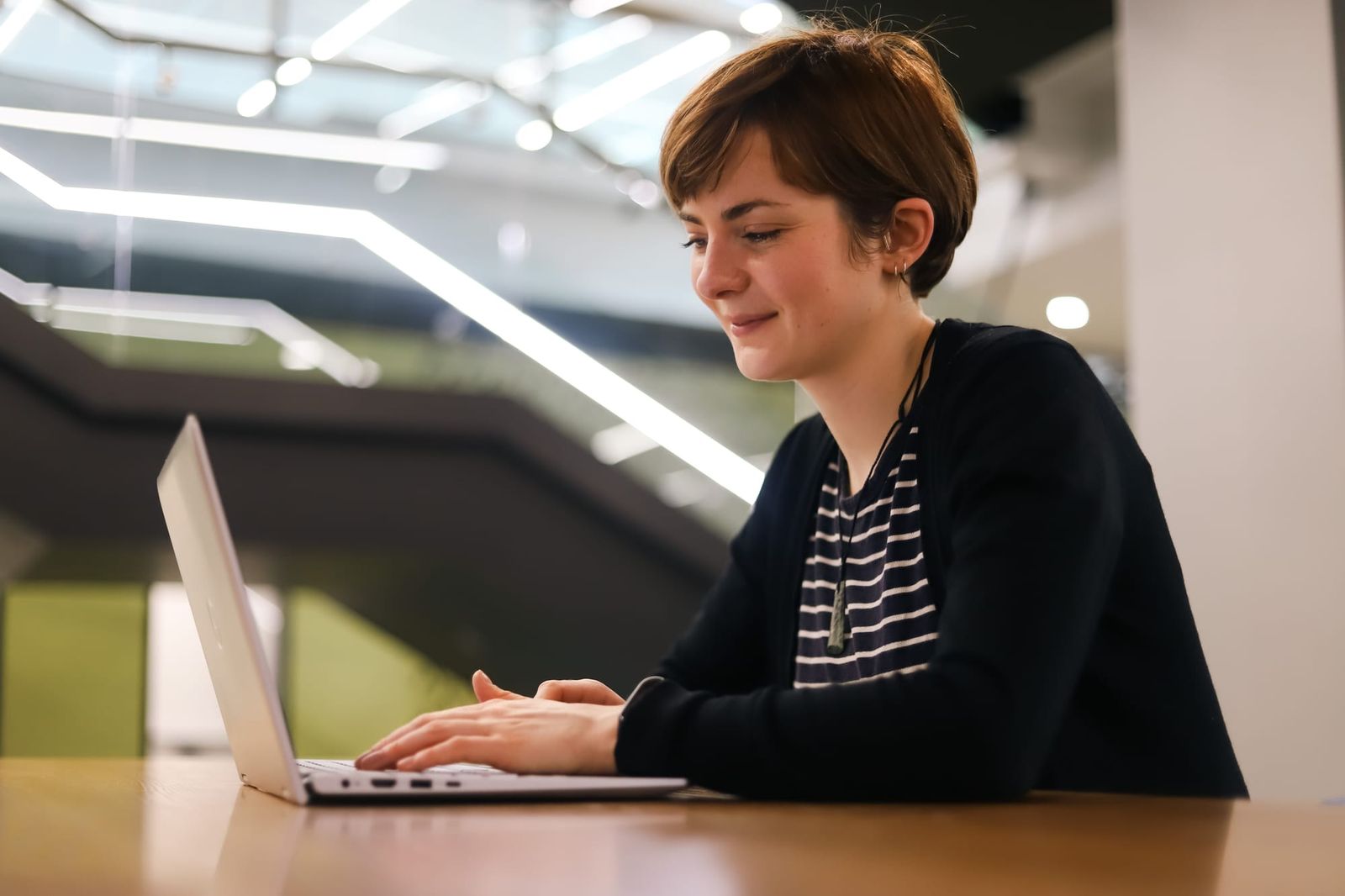 Woman typing on laptop