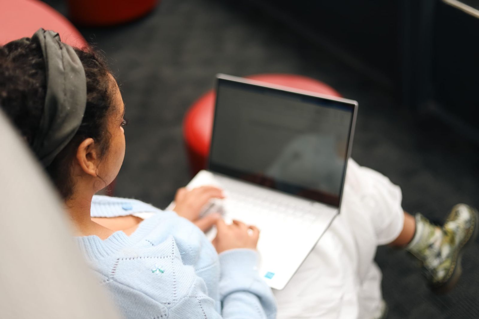 Woman working on laptop indoors