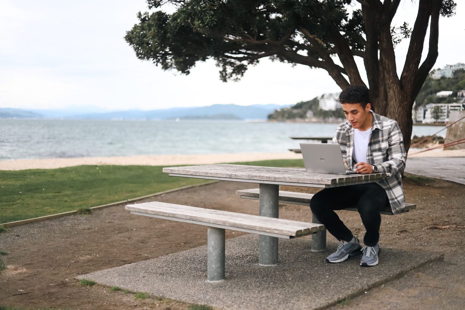 Man working outdoors at picnic table