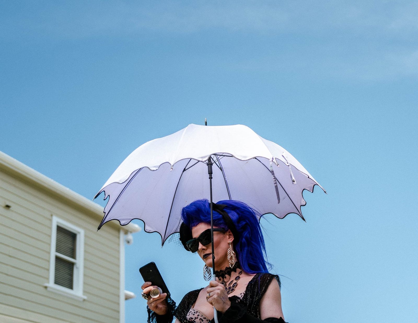 Woman with an umbrella and    blue hair
