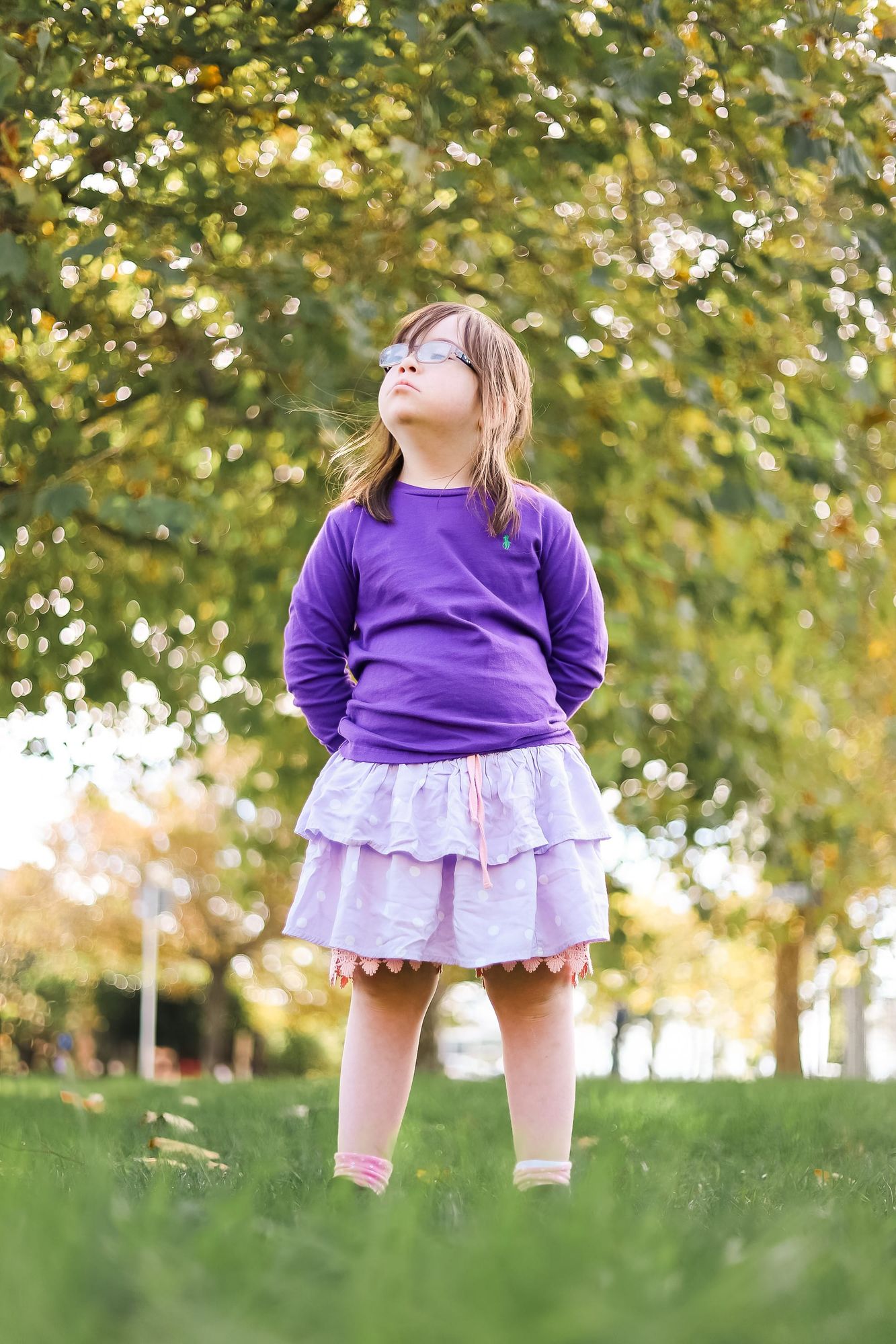 Child stands on the grass