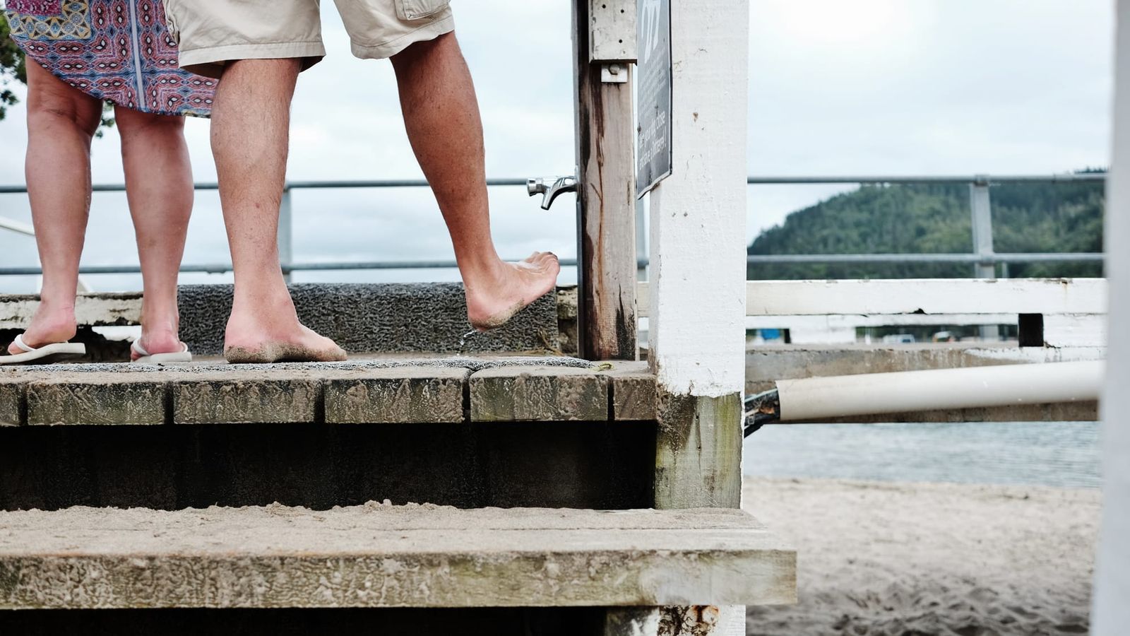 Barefoot couple on the pier