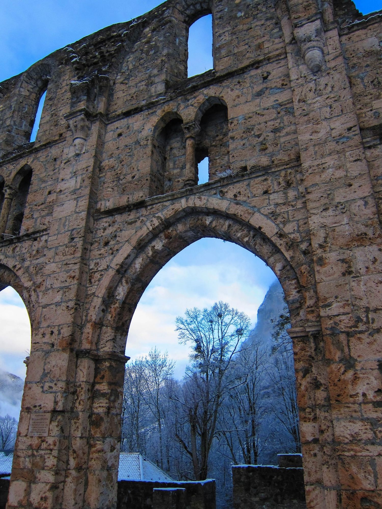 Gothic stone wall with snowy mountain backdrop