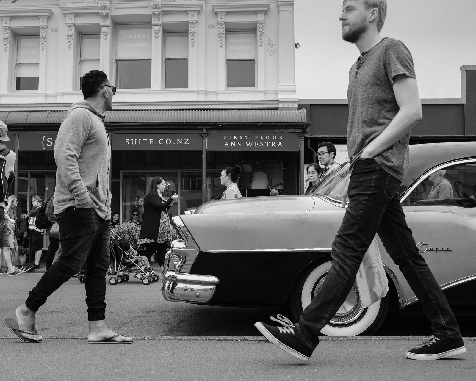 Vintage car and pedestrians