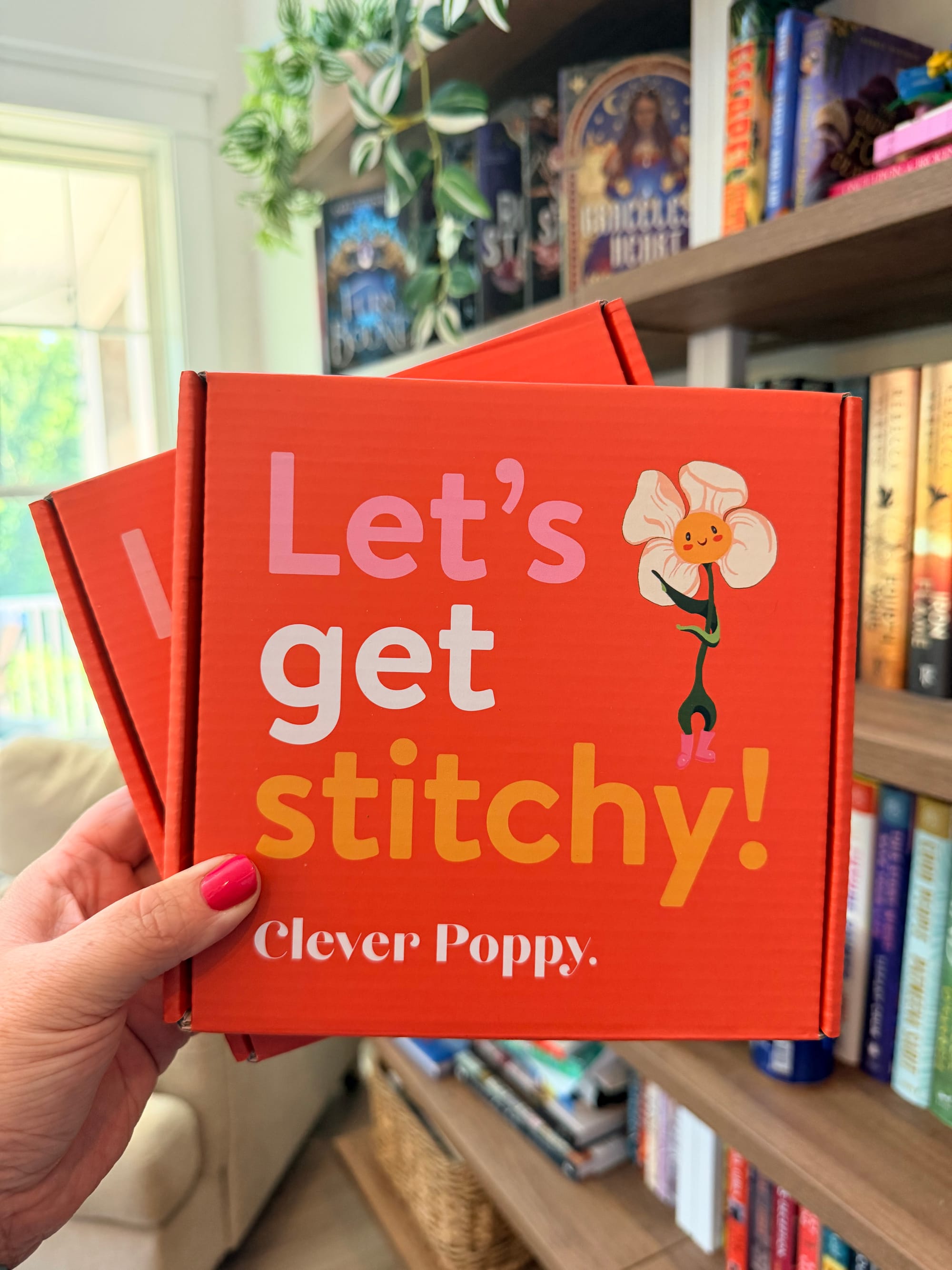 image holding two Clever Poppy embroidery kits