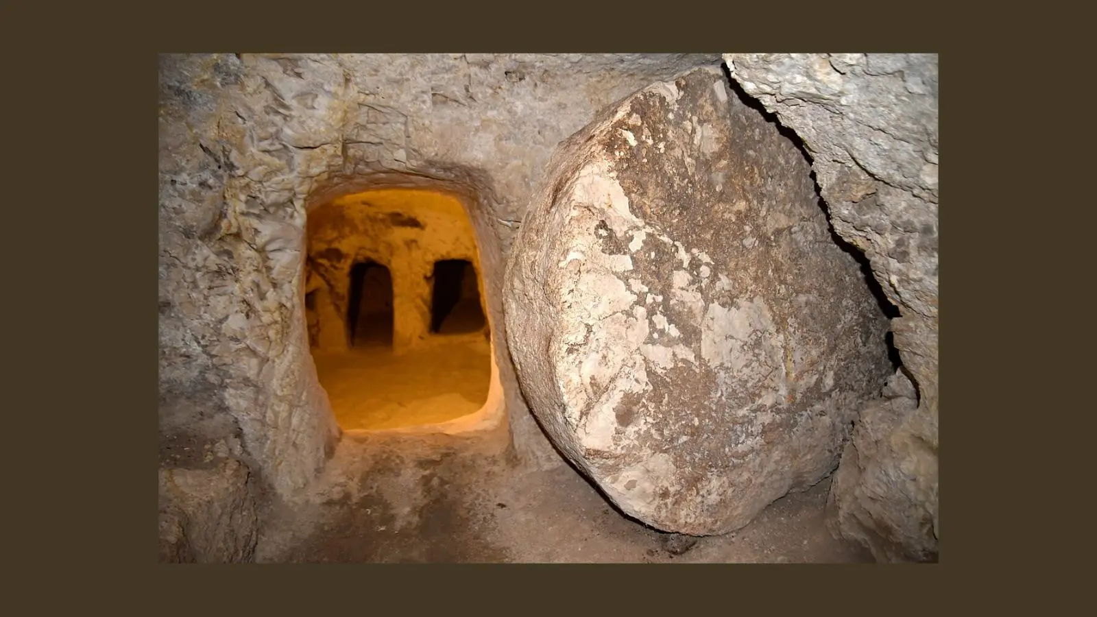 Rock-cut burial cave from first-century Galilee, with carved interior chambers and rolling stone architecture