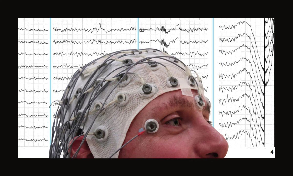 A person wearing an EEG cap with scalp electrodes, overlaid on EEG waveform traces, illustrating how brain activity is measured from the surface rather than the entire brain.