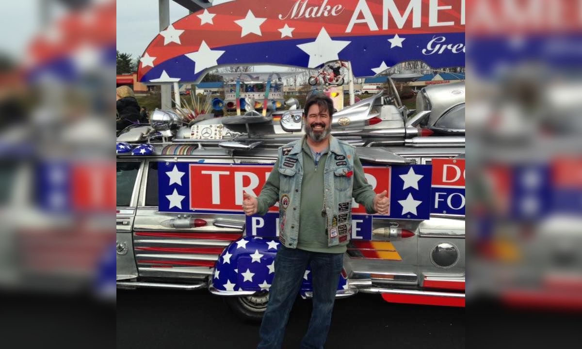 New Jersey Freeholder John Carman in front of Trump display