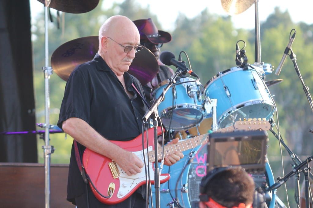 Dave Mason of Traffic playing guitar at Memorial Park in Omaha. in 2022