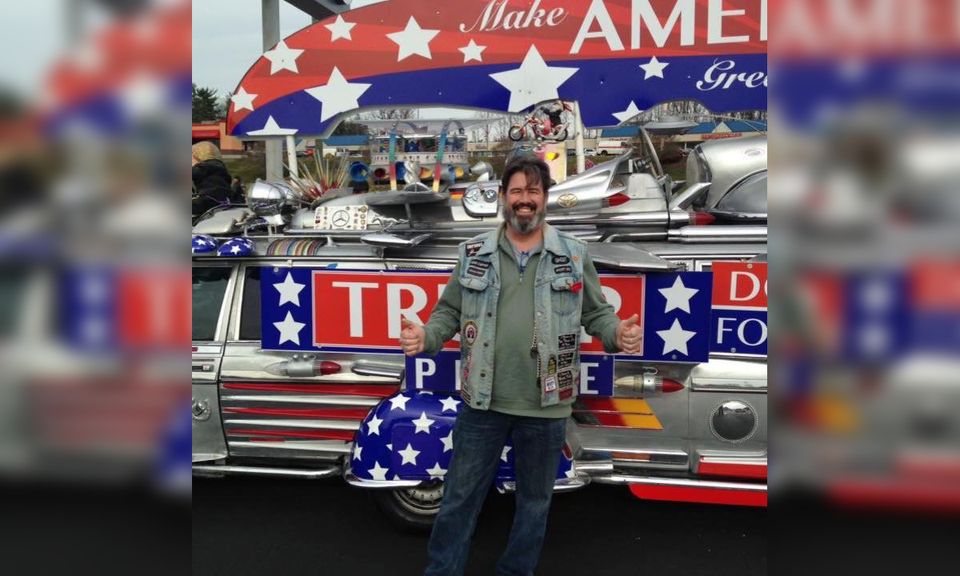 New Jersey Freeholder John Carman in front of Trump display