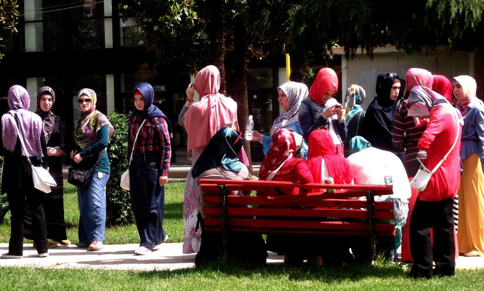 Muslim women gathering outside of a school in Albania.