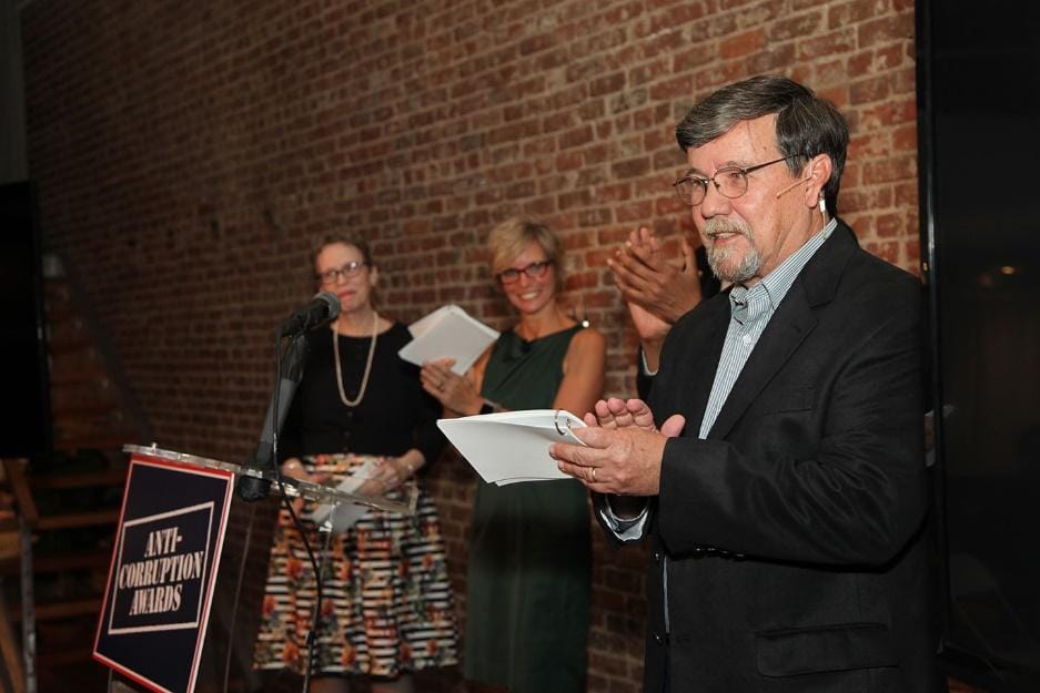 A person in a suit and tieDescription automatically generated