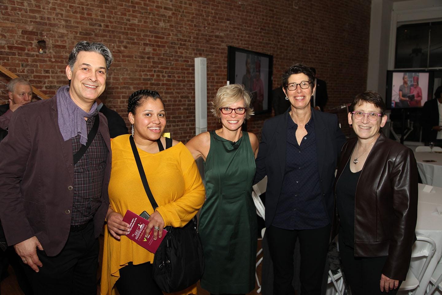 A group of people posing for a photoDescription automatically generated