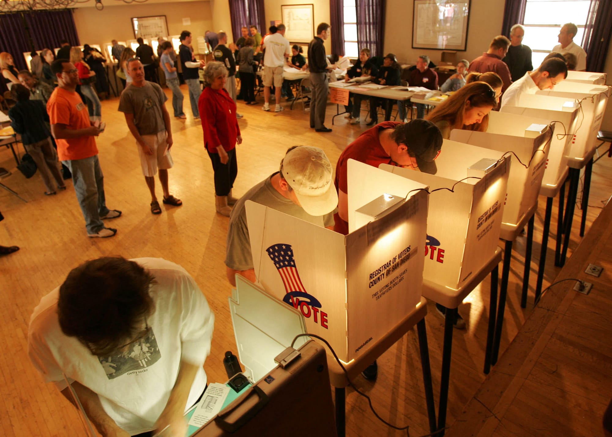 California voters at the polls. A new poll shows most Latino voters want to keep nonpartisan open primaries. 