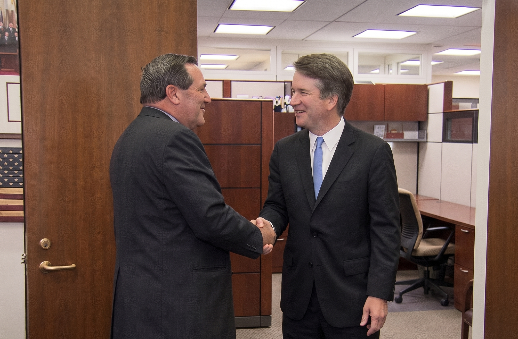 Justice Brett Kavanaugh shakes hands with a U.S. senator
