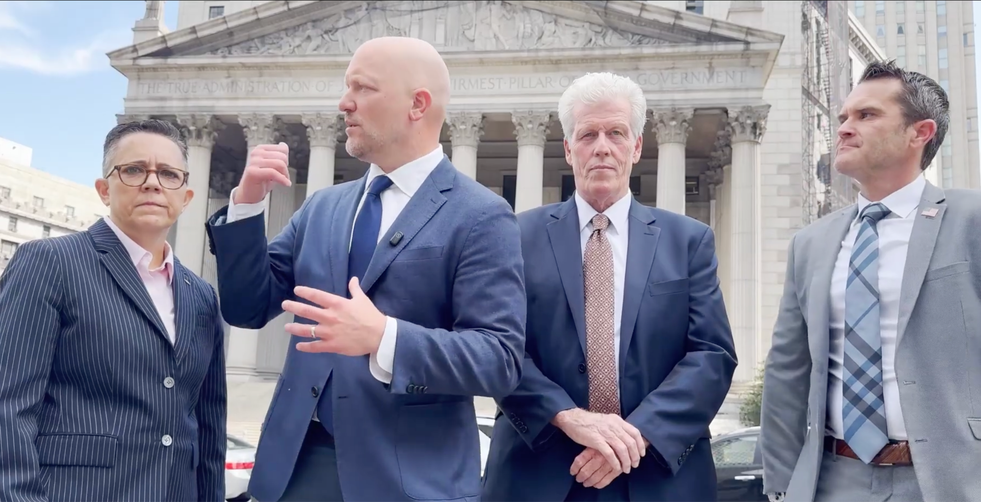 Plaintiffs and attorneys outside the federal courthouse in Manhattan