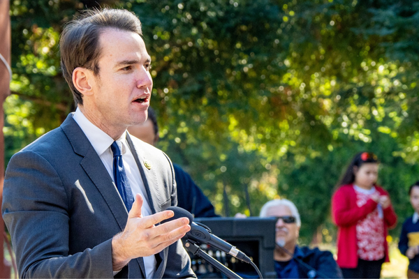 Kevin Kiley speaking at outdoor event.