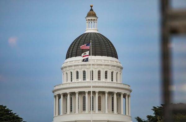 California capitol building with flags.