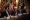 Trump seated at a long table, gesturing, and speaking. Pete Hegseth sits to his left and Marco Rubio to his right.