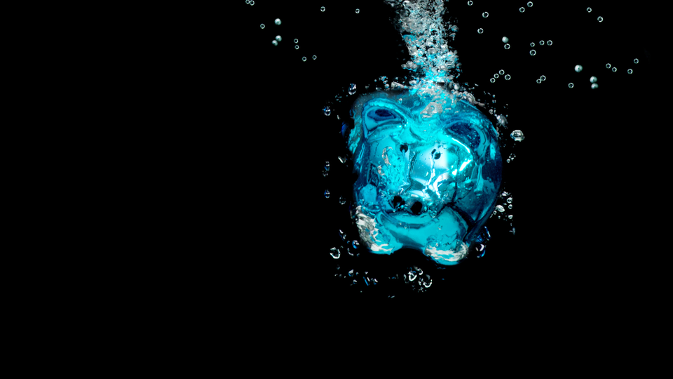 Image by Getty Signature from Canva pro of blue piggy bank in dark water with bubbles