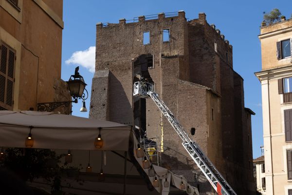 Firefighters check the Torre dei Conti at the Imperial Forum in Rome after partial collaps