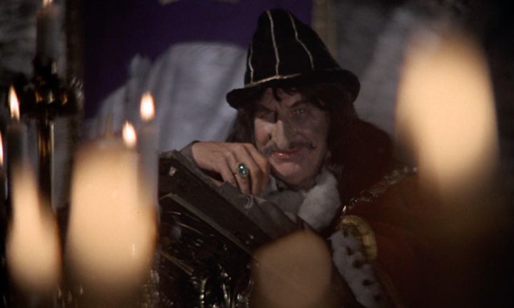 Vincent Price smirking