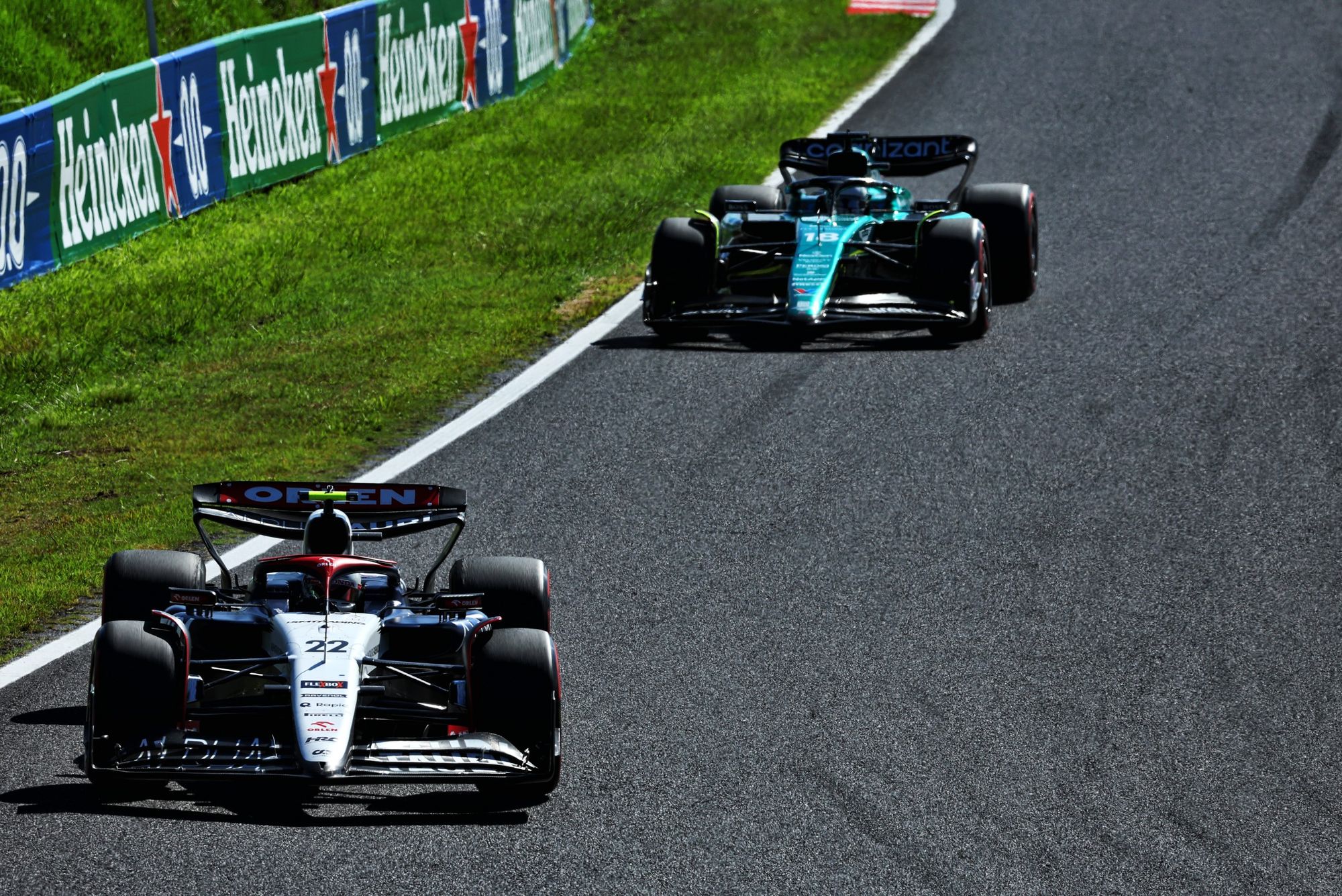 Yuki Tsunoda, AlphaTauri, and Lance Stroll, Aston Martin, F1