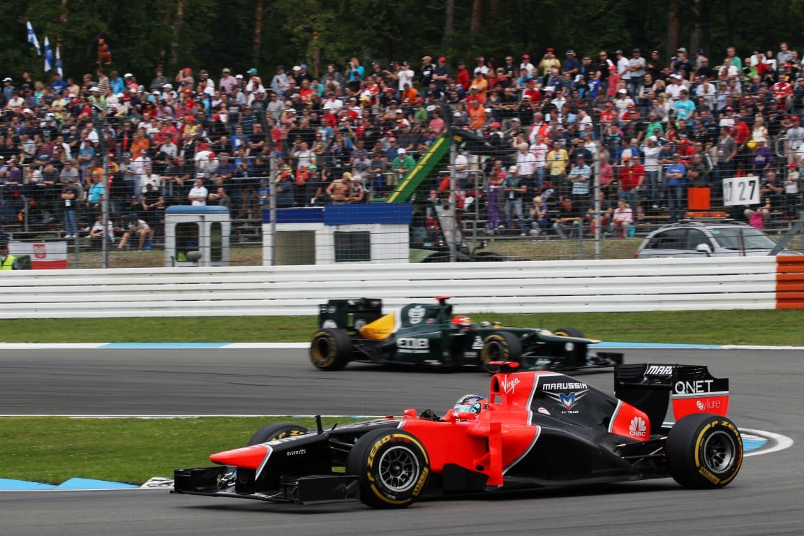 Timo Glock, Marussia, and Heikki Kovalainen, Caterham, F1