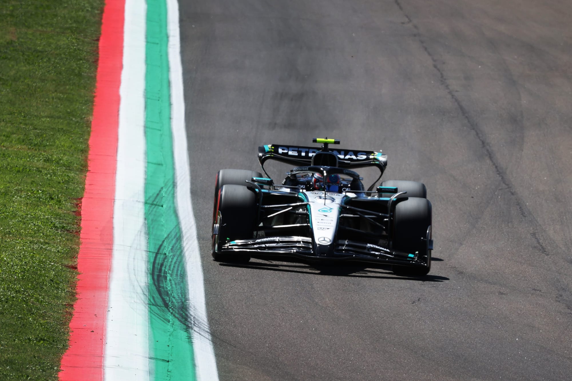 Mercedes F1 car at Imola, 2025, head on image with Italian flag kerbs on left