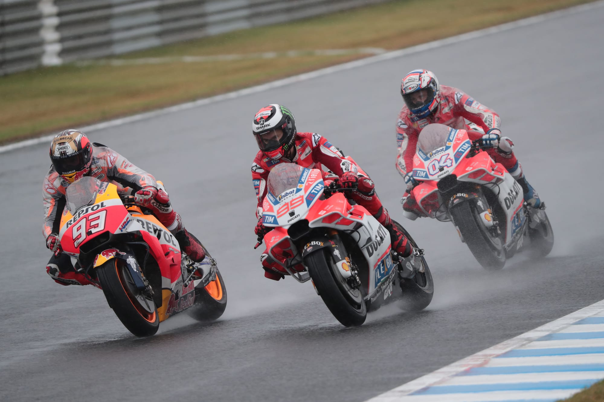 Marc Marquez, Honda, races Jorge Lorenzo and Andrea Dovizioso's Ducatis at MotoGP's 2017 Japanese Grand Prix