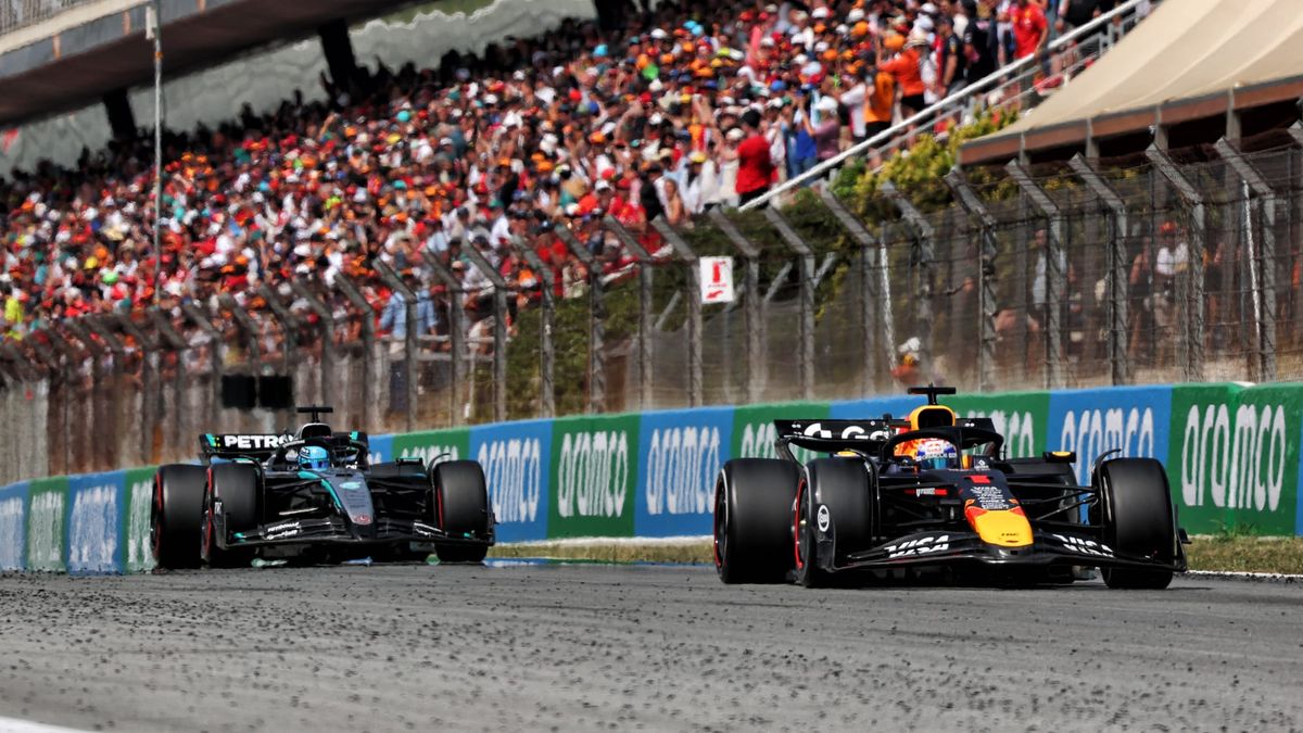 Max Verstappen (R) leading George Russell (L) in the 2025 Spanish GP