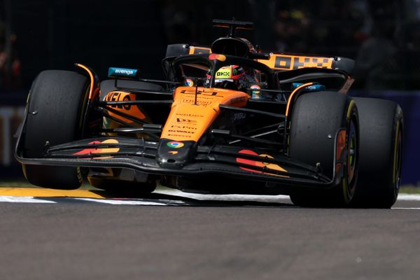 McLaren F1 car going over kerbs at Imola 2025
