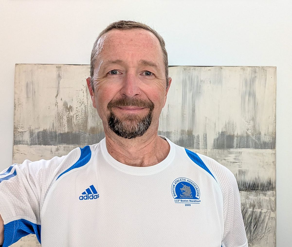 Man with goatee wearing a Boston Marathon t-shirt