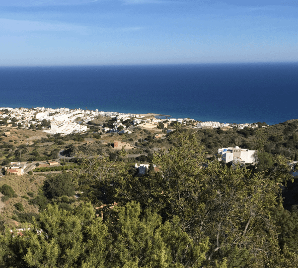 Green-covered hills leading to blue sea - Moral Letters to Lucilius