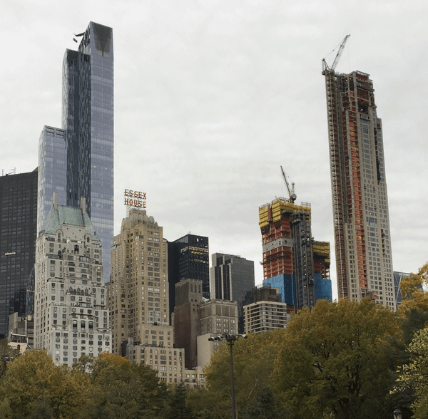 Skyscrapers lining Central Park in New York, with a view of the Essex House