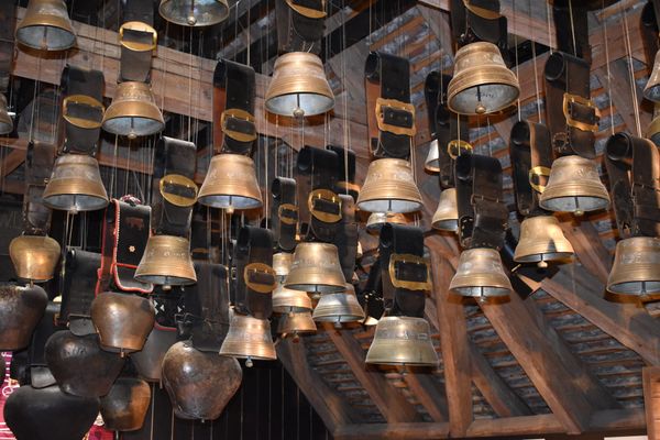 Many brass cowbells hanging from the rafters of a barn. Don't get me started on our cows and chocolate