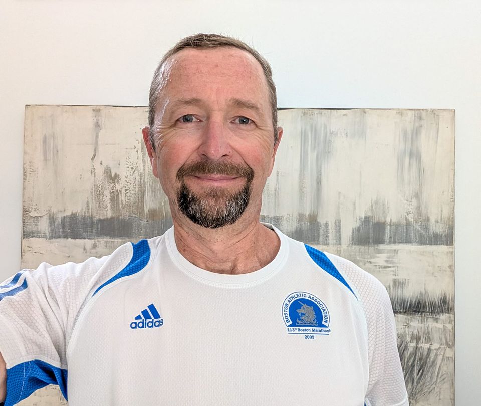Man with goatee wearing a Boston Marathon t-shirt