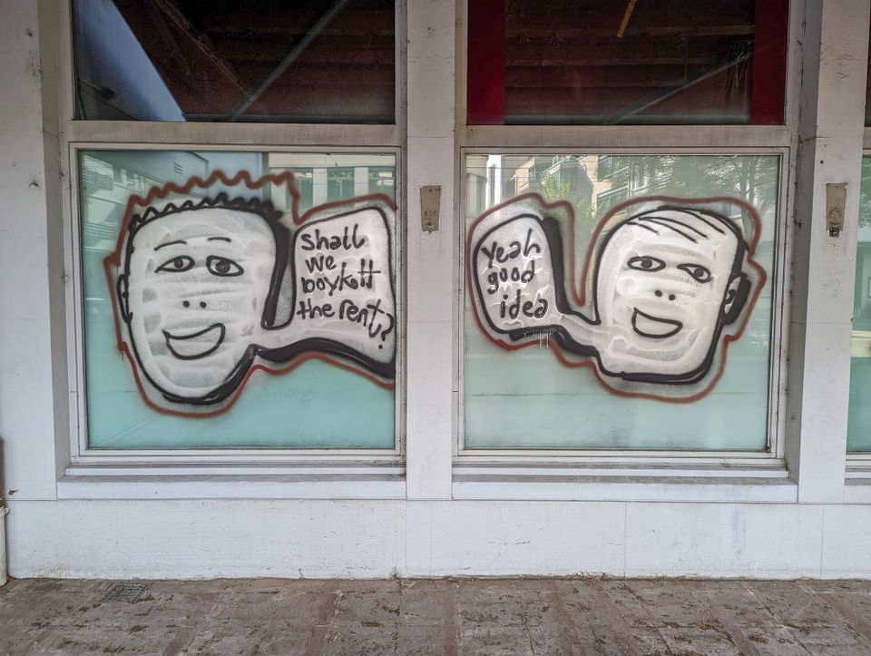 Graffiti of two heads, one saying "Shall we boykott the rent?" and the other answering "Yeah good idea"
