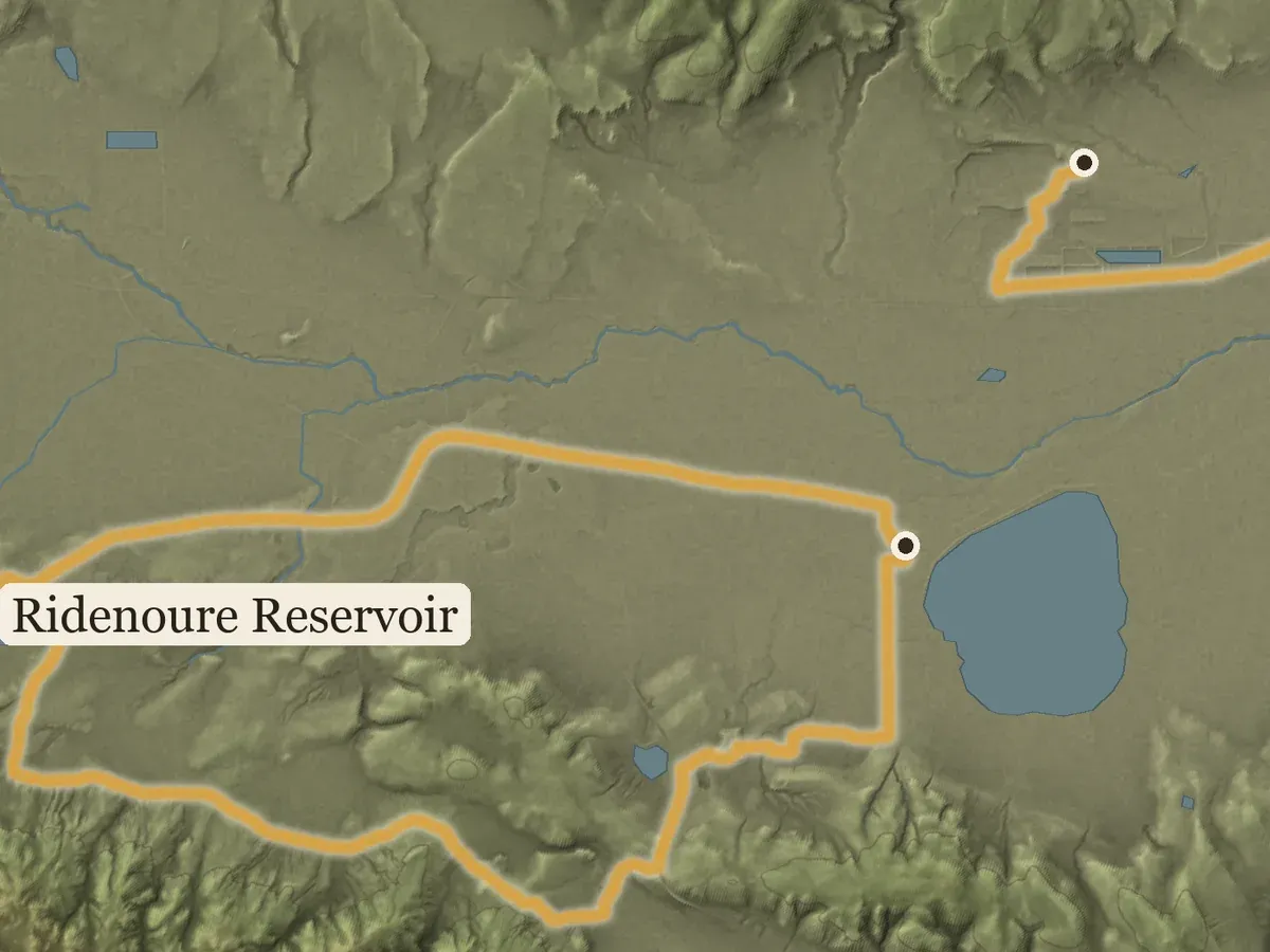 Close view of the Lassen County poster: a gold loop around Ridenoure Reservoir, with creeks winding across the flats.