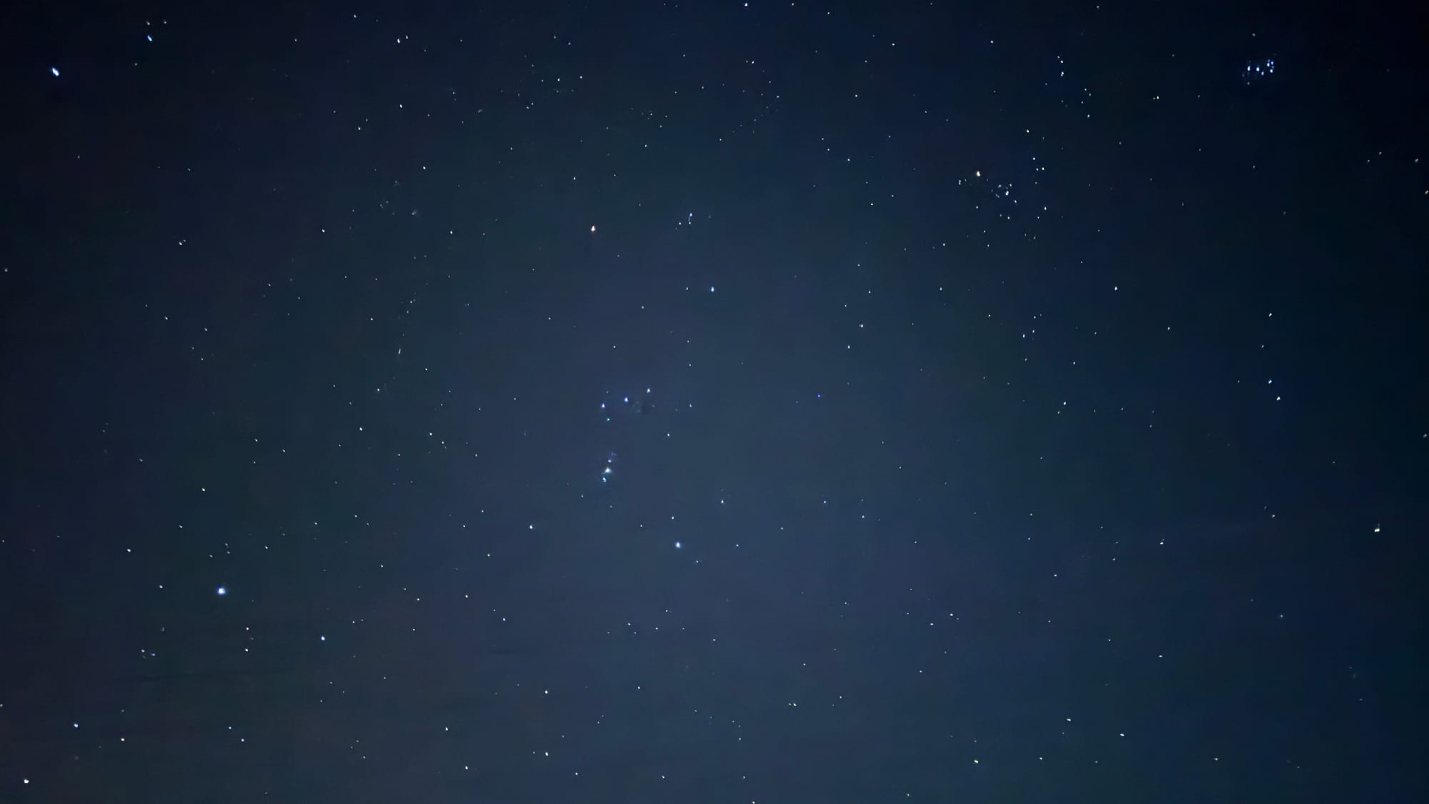 Starry night with Orion, Pleiades, and in the lower left, Sirius.