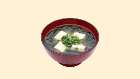 Miso soup in a red bowl