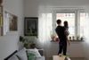 Family looking out the window of apartment