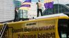 "Deutsche Wohnen & Co. enteignen" protesters atop a campaign bus