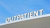 Outpatient sign atop the roof edge
