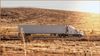 Container truck travelling along a road