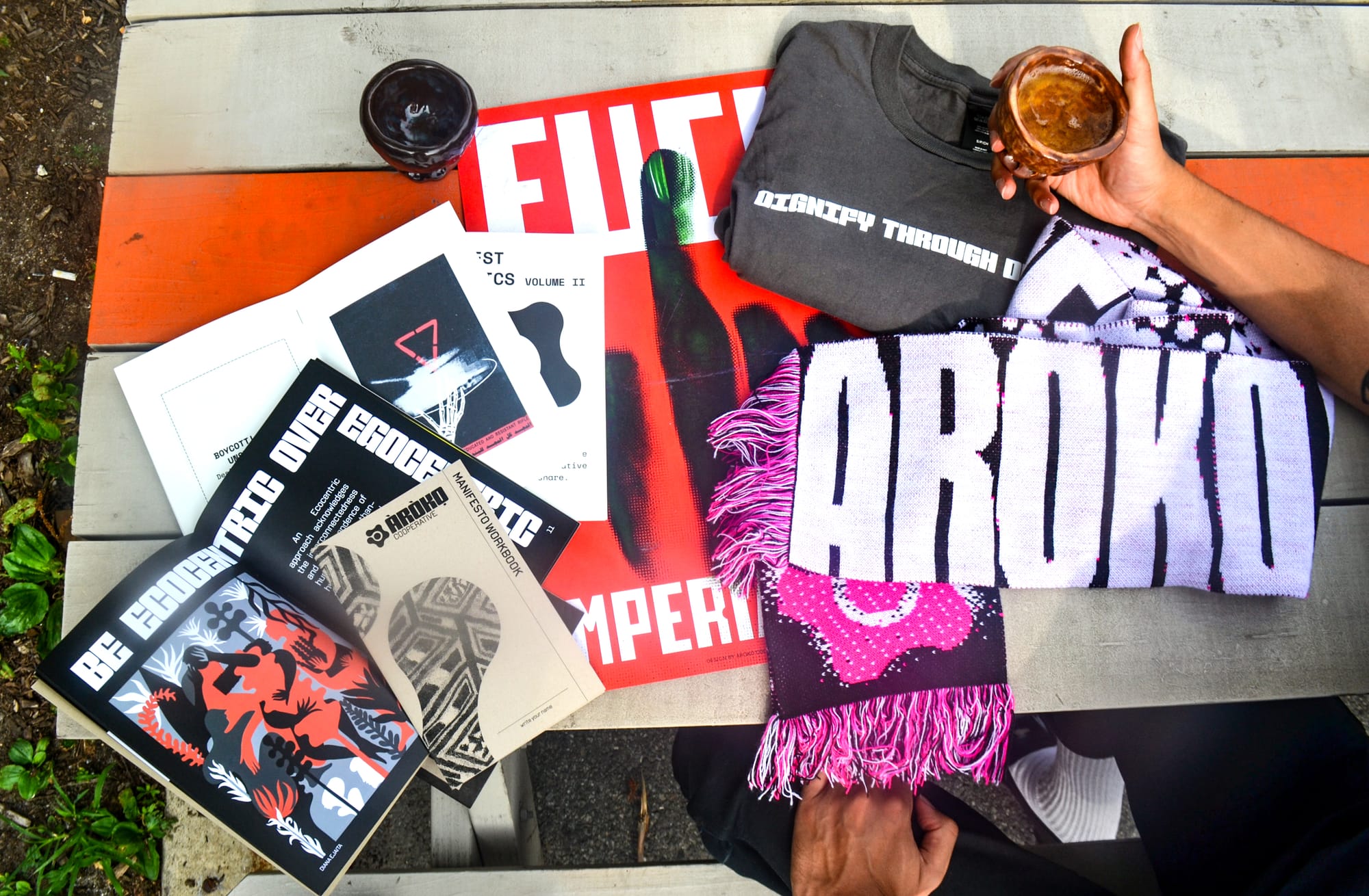An overhead shot of a full range of products, with the Design to Divest manifesto featured at the bottom left.