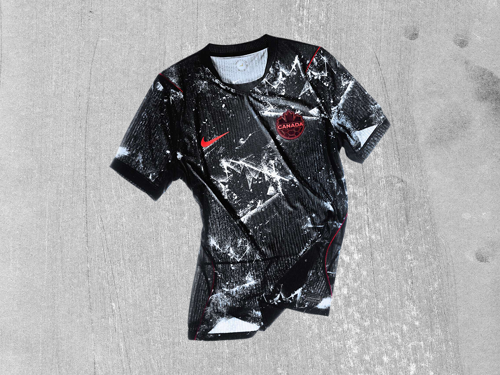 The 2026 Canada away kit which is black covered in white splotches.