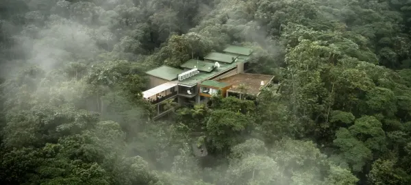 Aerial view of Mashpi Lodge surrounded by misty Chocó cloud forest, Ecuador