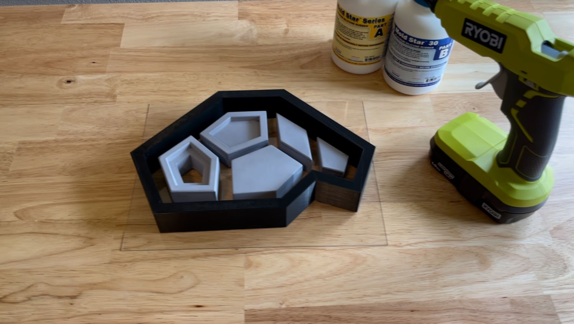 All components and mold shell layed out and hot glued to plastic base.